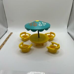 Vintage Fisher-Price Playset with Yellow Chairs and Blue Umbrella